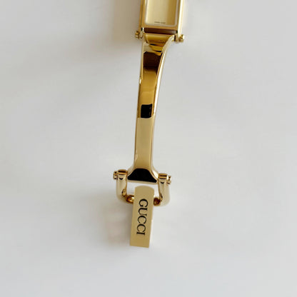 Gucci 1990s Rectangular Dial Gold Plated Bangle Watch