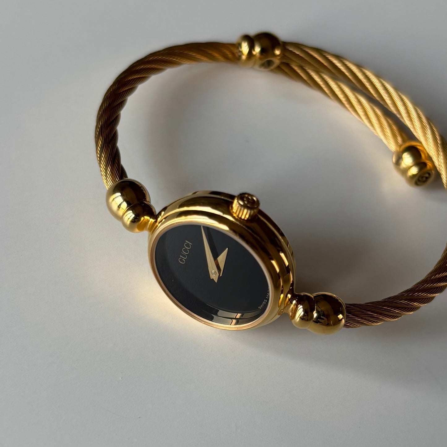 Gucci 1990s Black Dial Gold Plated Cable Bangle Watch