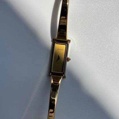 Gucci 1990s Gold Rectangular Dial Gold Plated Bangle Watch
