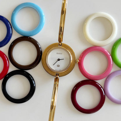 Gucci 1980s Interchangeable Bezel Gold Plated Bangle Watch with 12 bezels, case