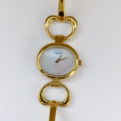 Gucci 1990s Seashell Dial Oval Gold Plated Bangle Watch