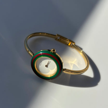 Gucci 1990s Interchangeable Bezel Gold Plated Bangle Watch with 12 bezels, case