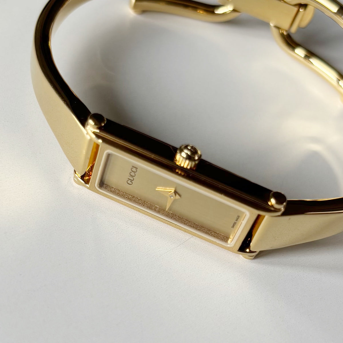 Gucci 1990s Gold Rectangular Dial Gold Plated Bangle Watch
