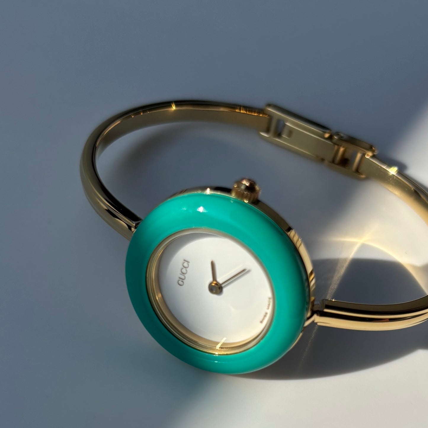 Gucci 1990s Interchangeable Bezel Gold Plated Bangle Watch with 12 bezels, case