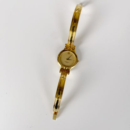 Givenchy 1990s Gold Plated Round Bangle Watch