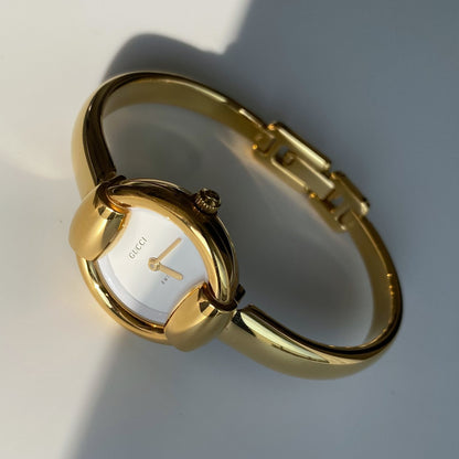 Gucci 1990s Round Dial Gold Plated Bangle Watch