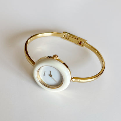 Gucci 1990s Interchangeable Bezel Gold Plated Bangle Watch with 12 bezels, case