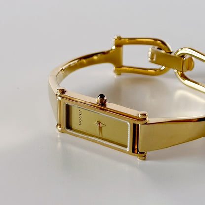 Gucci 1990s Rectangular Gold Dial Gold-Plated Watch
