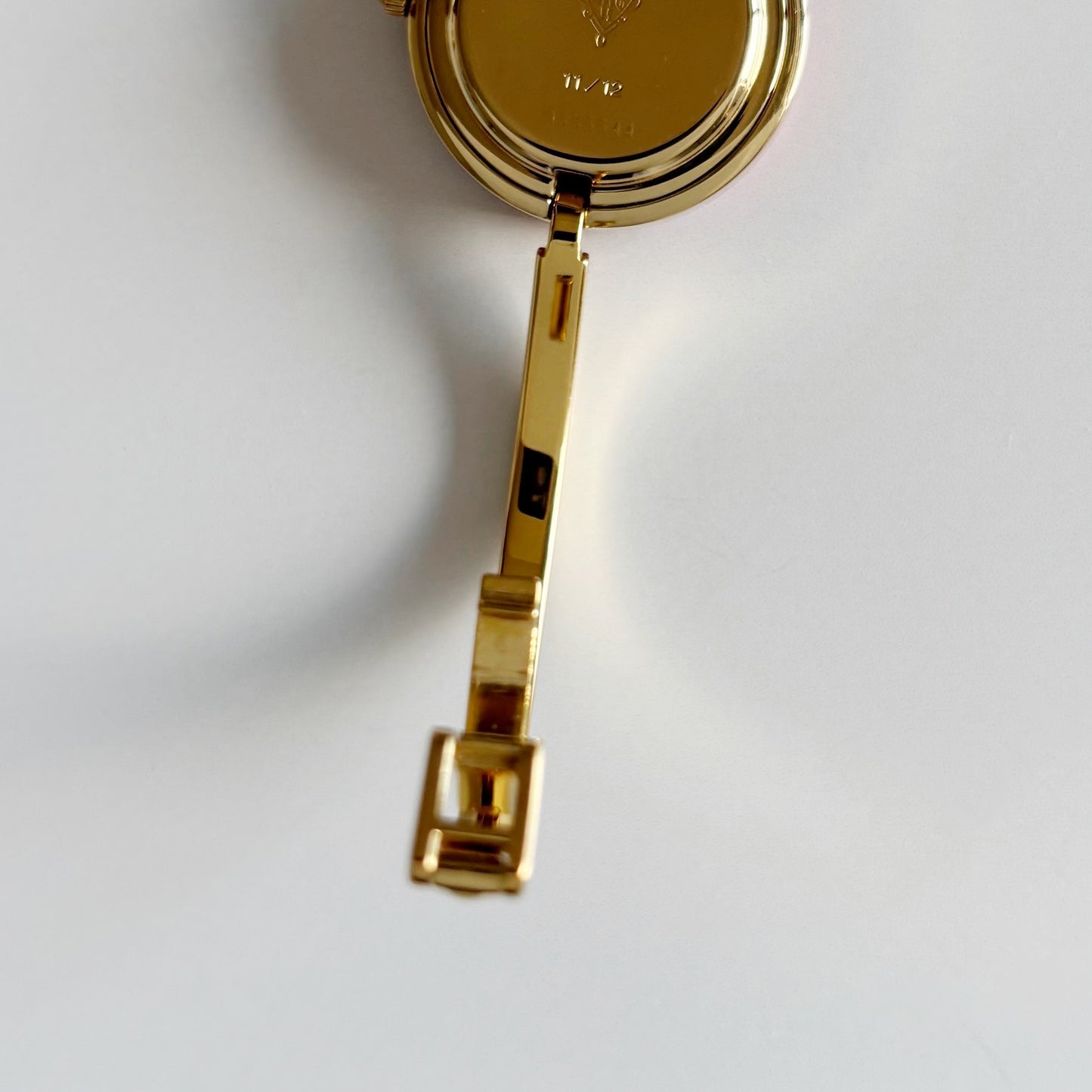 Gucci 1990s Interchangeable Bezel Gold Plated Bangle Watch with 12 bezels, case