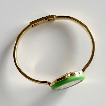 Gucci 1990s Interchangeable Bezel Gold Plated Bangle Watch with 12 bezels, case