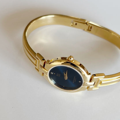 Givenchy 1990s Navy Round Dial Gold Plated Bangle Watch