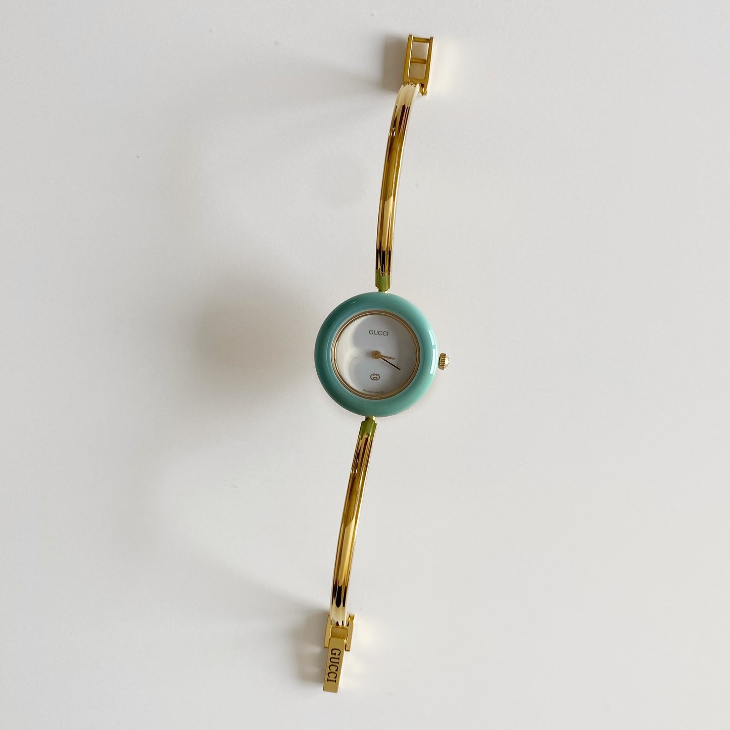 Gucci 1990s Interchangeable Bezel Gold Plated Bangle Watch with 12 bezels, case