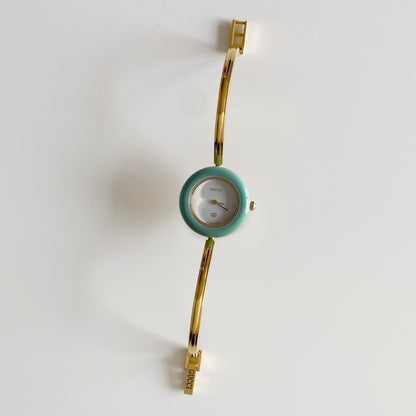 Gucci 1990s Interchangeable Bezel Gold Plated Bangle Watch with 12 bezels, case