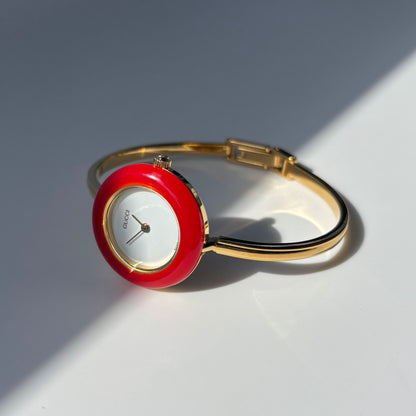 Gucci 1990s Interchangeable Bezel Gold Plated Bangle Watch with 12 bezels, case