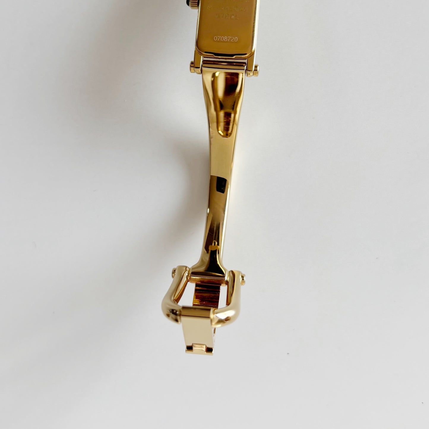 Gucci 1990s Rectangular Gold Dial Gold Plated Bangle Watch