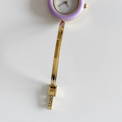 Gucci 1990s Interchangeable Bezel Gold Plated Bangle Watch with 12 bezels, case