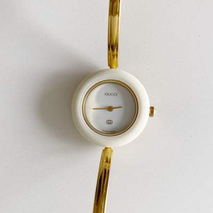Gucci 1990s Interchangeable Bezel Gold Plated Bangle Watch with 12 bezels, case