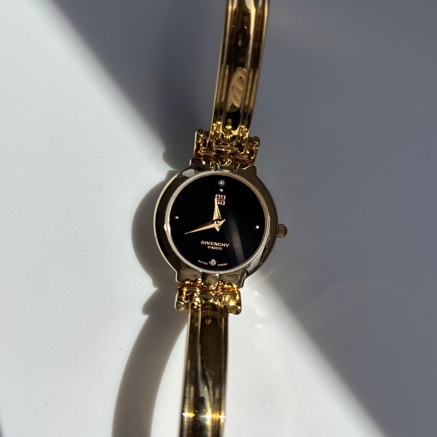 Givenchy 1990s Black Round Dial Gold Plated Bangle Watch