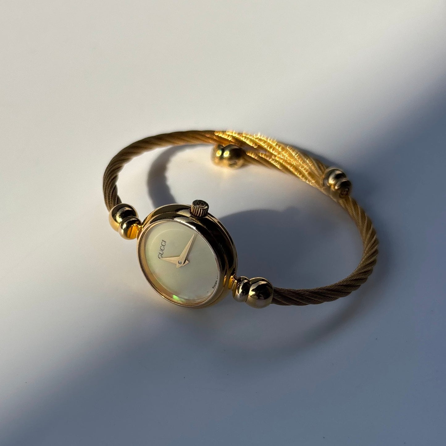 Gucci 1990s Seashell Dial Gold Plated Cable Bangle Watch