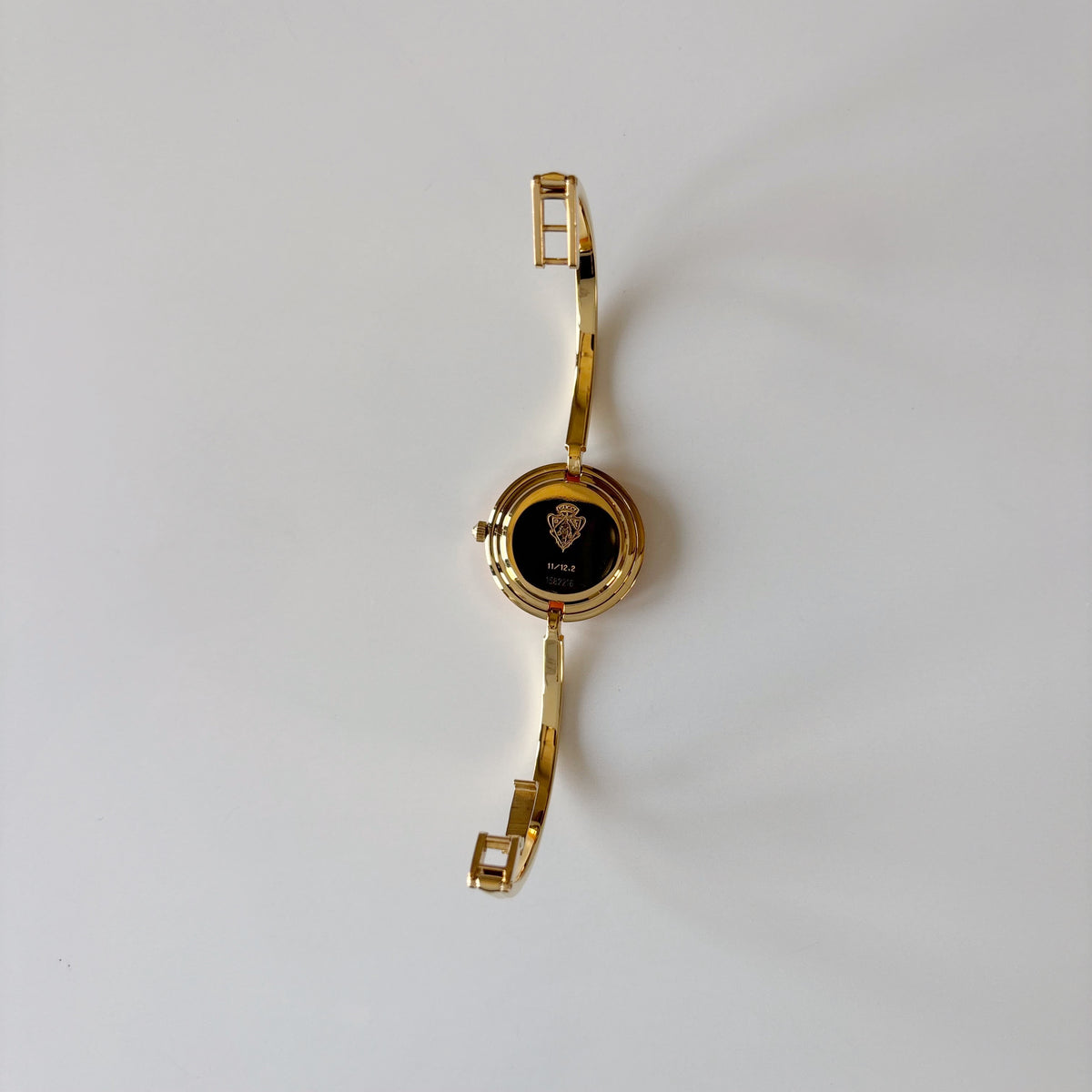 Gucci 1990s Interchangeable Bezel Gold Plated Bangle Watch with 12 bezels, case