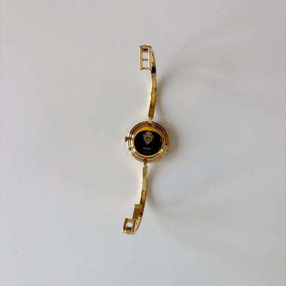 Gucci 1990s Interchangeable Bezel Gold Plated Bangle Watch with 12 bezels, case