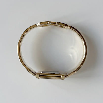 Yves Saint Laurent 1990s Peek-A-Boo Gold Plated Bangle Watch
