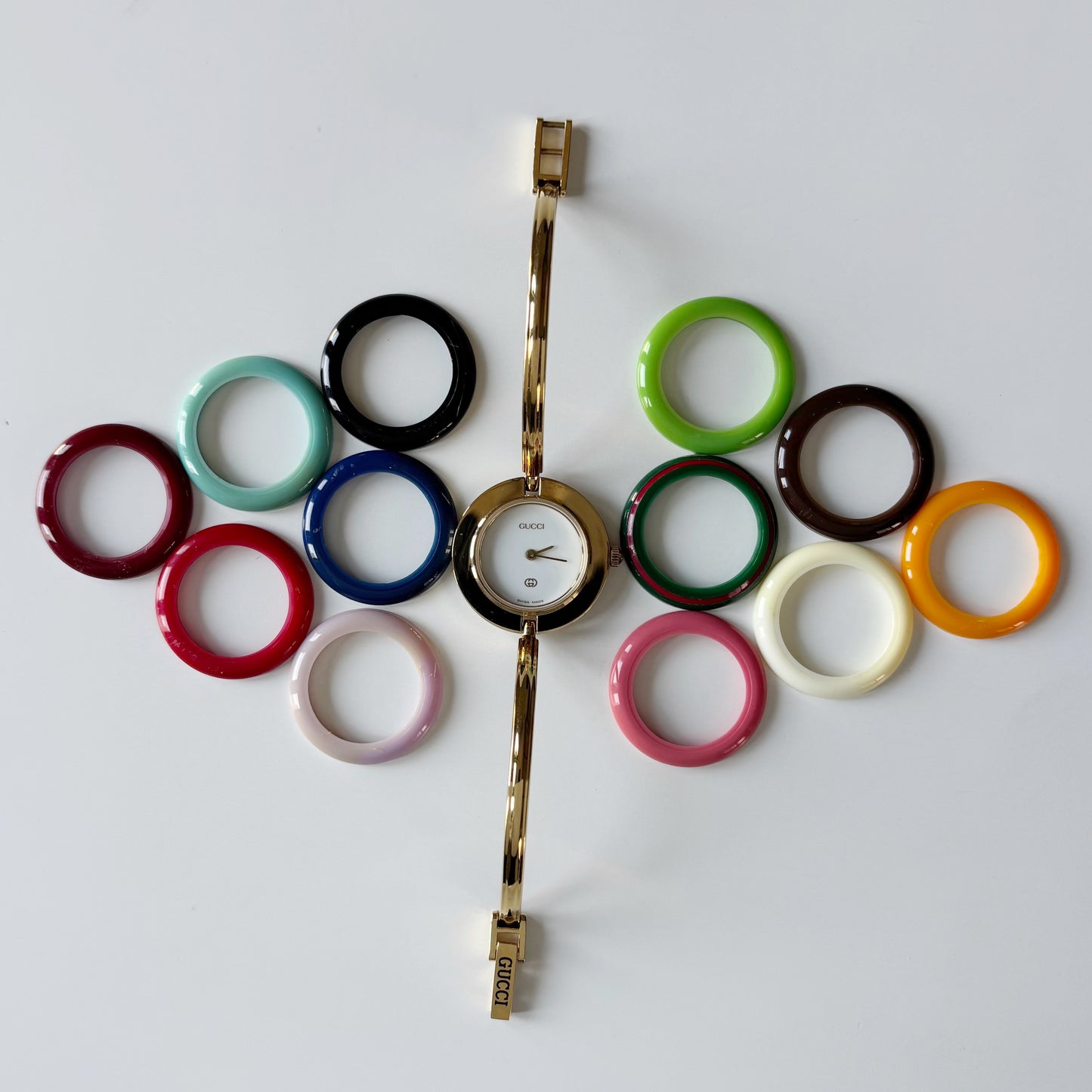 Gucci 1990s Interchangeable Bezel Gold Plated Bangle Watch with 12 bezels, case