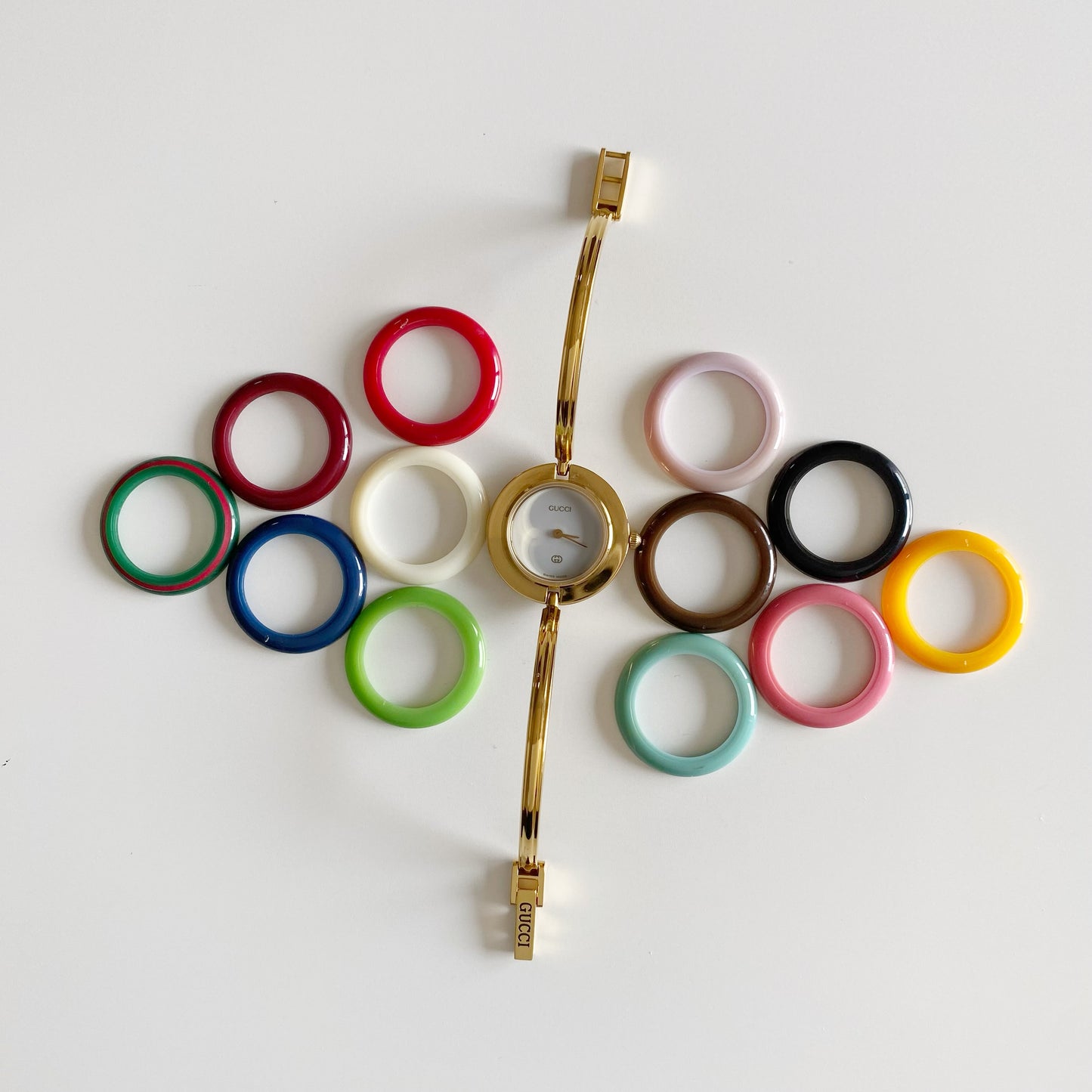 Gucci 1990s Interchangeable Bezel Gold Plated Bangle Watch with 12 bezels, case