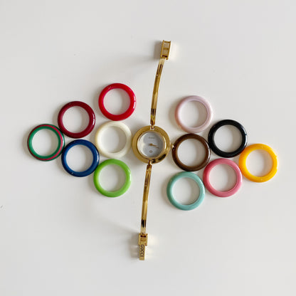 Gucci 1990s Interchangeable Bezel Gold Plated Bangle Watch with 12 bezels, case