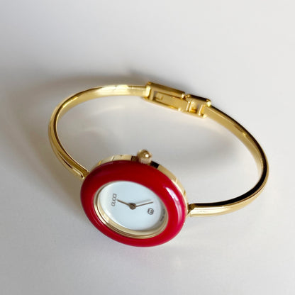Gucci 1990s Interchangeable Bezel Gold Plated Bangle Watch with 12 bezels, case