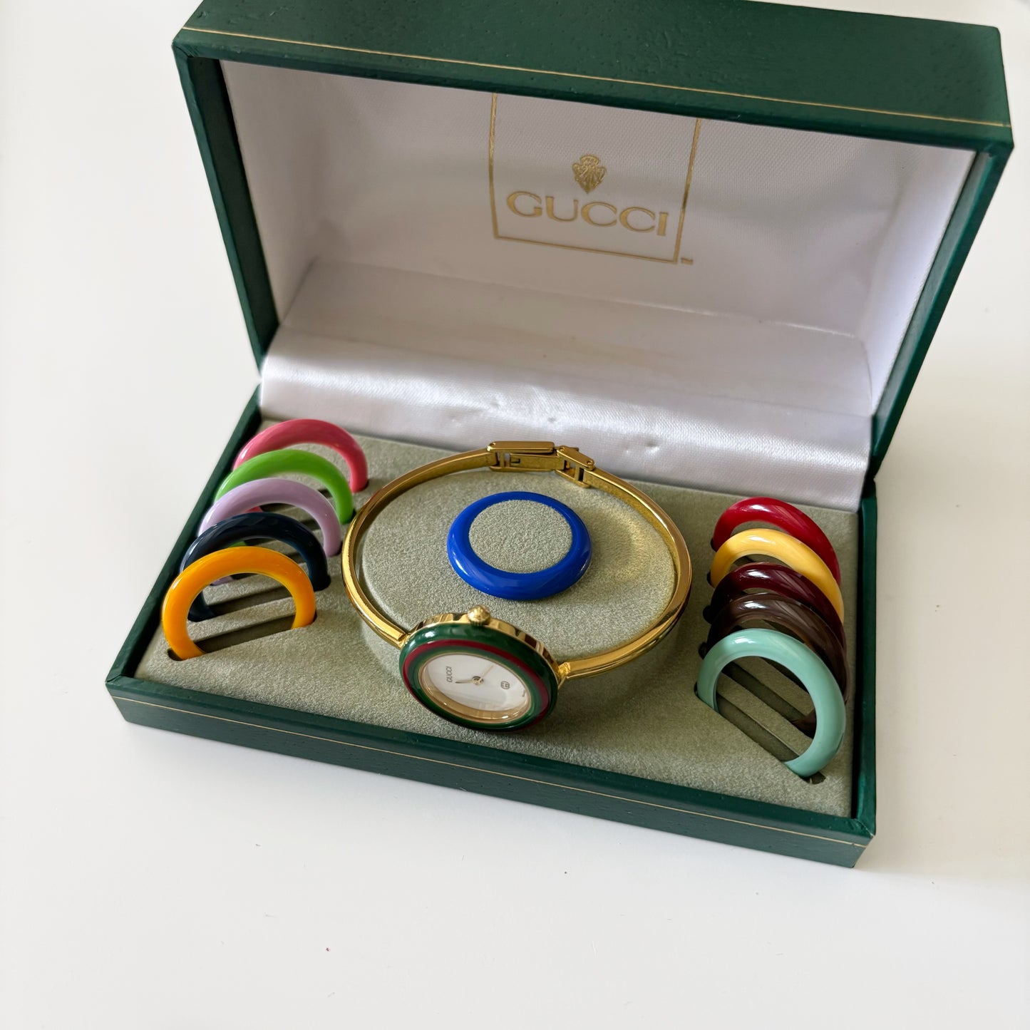 Gucci 1990s Interchangeable Bezel Gold Plated Bangle Watch with 12 bezels, case