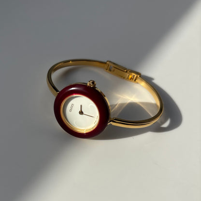 Gucci 1990s Interchangeable Bezel Gold Plated Bangle Watch with 12 bezels, case