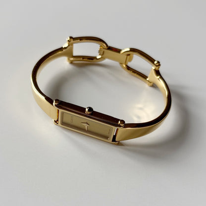 Gucci 1990s Gold Rectangular Dial Gold Plated Bangle Watch
