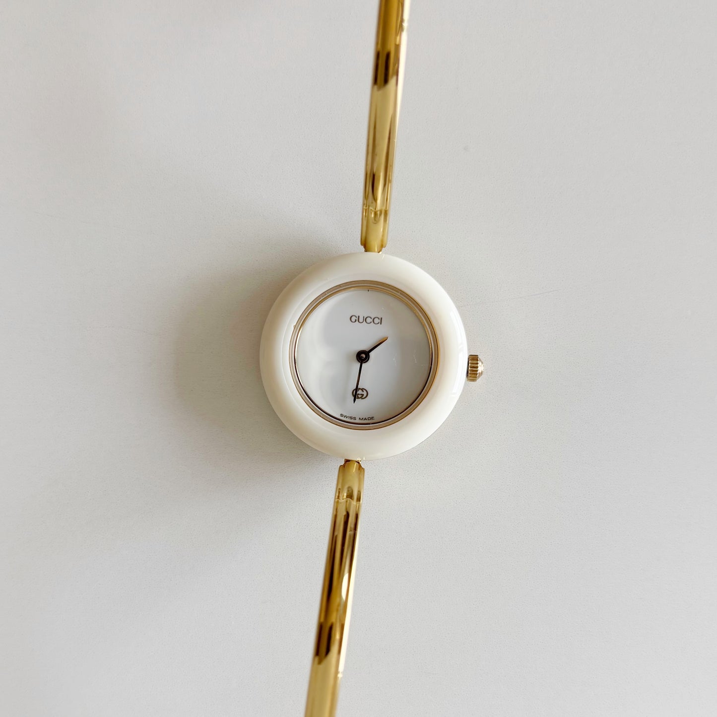 Gucci 1990s Interchangeable Bezel Gold Plated Bangle Watch with 12 bezels, case