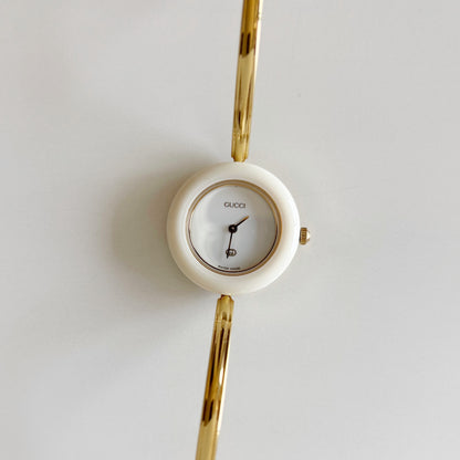 Gucci 1990s Interchangeable Bezel Gold Plated Bangle Watch with 12 bezels, case