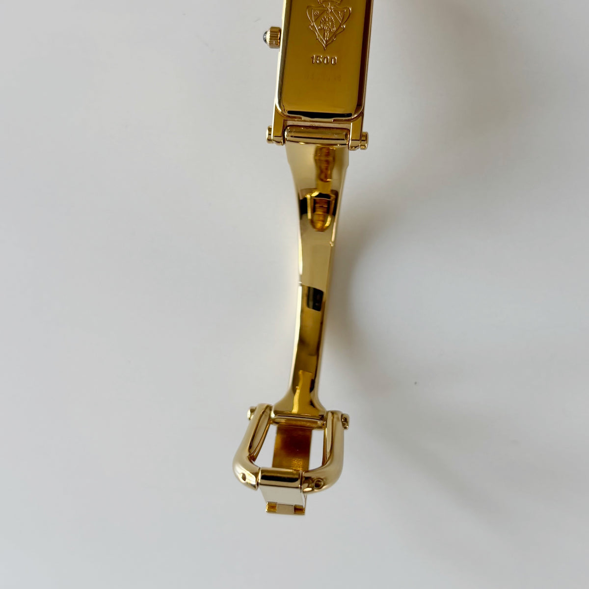 Gucci 1990s Rectangular Gold Dial Gold Plated Bangle Watch