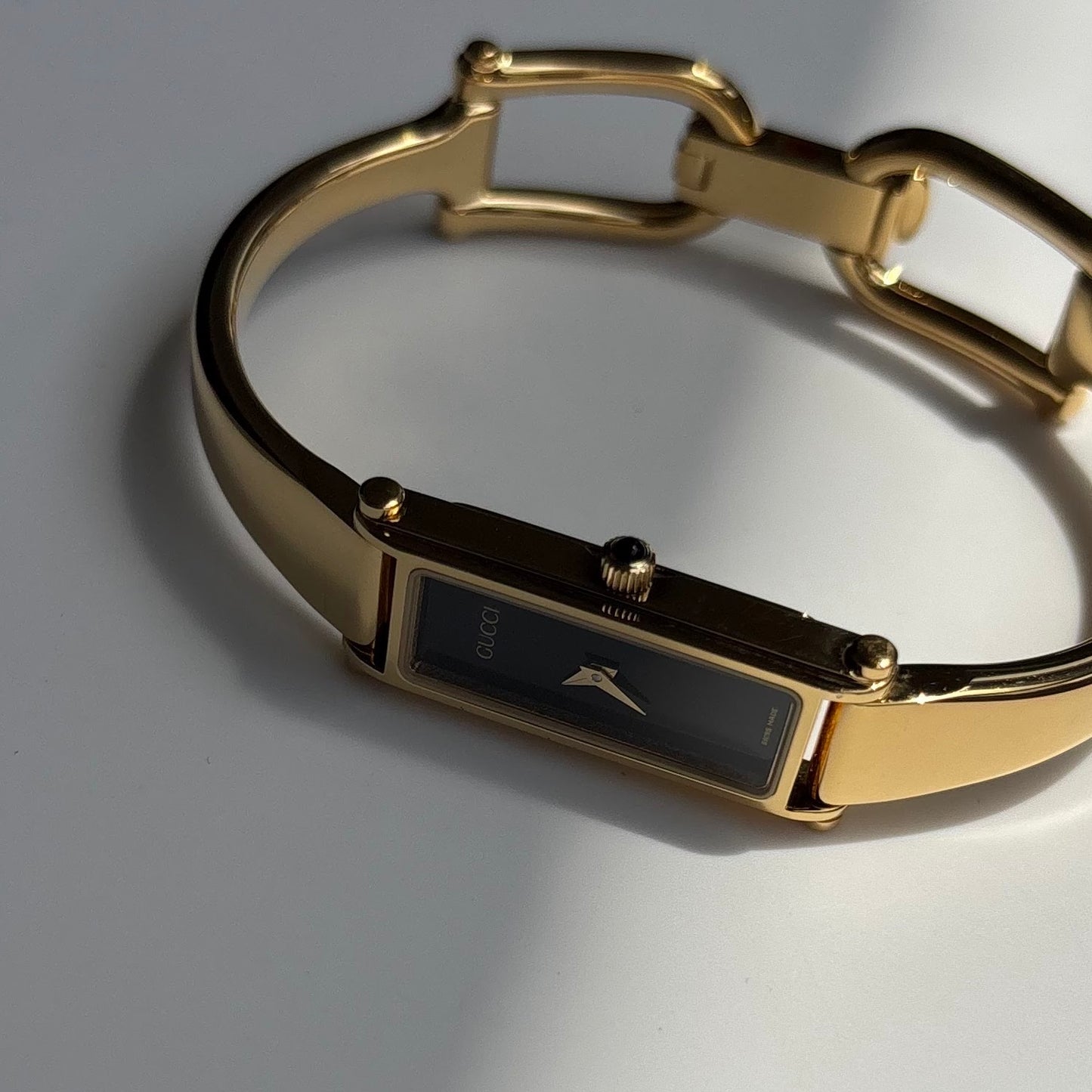 Gucci 1990s Black Rectangular Dial Gold Plated Bangle Watch