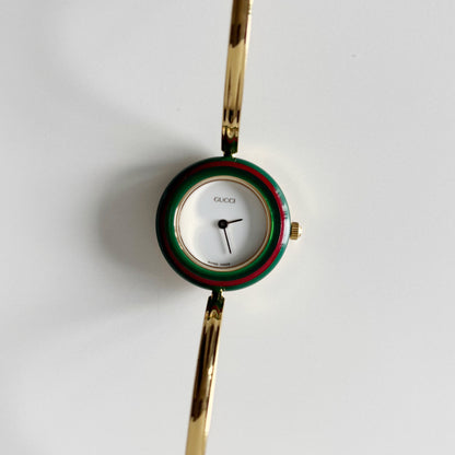 Gucci 1990s Interchangeable Bezel Gold Plated Bangle Watch with 12 bezels, case