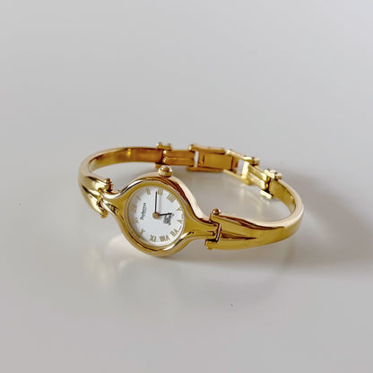 Burberry 1990s Round Dial Gold Plated Bangle Watch