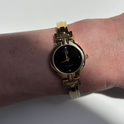 Givenchy 1990s Black Round Dial Gold Plated Bangle Watch