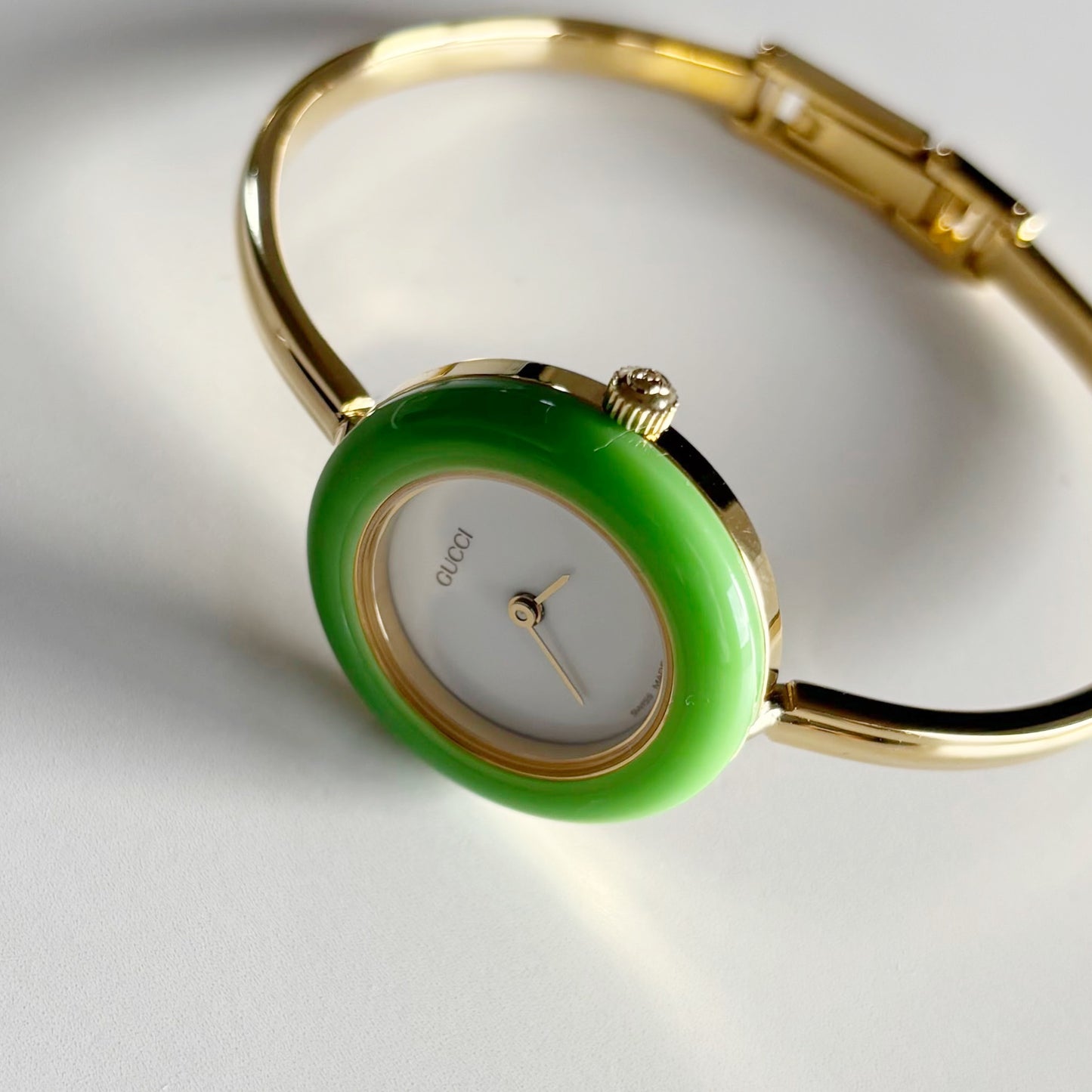 Gucci 1990s Interchangeable Bezel Gold Plated Bangle Watch with 12 bezels, case