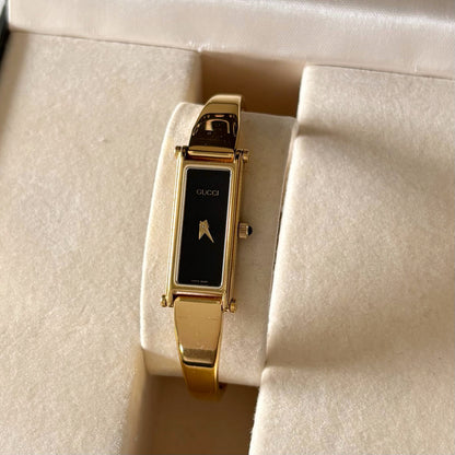 Gucci 1990s Black Dial Rectangular Gold Plated Bangle Watch