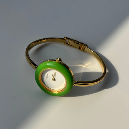 Gucci 1990s Interchangeable Bezel Gold Plated Bangle Watch with 12 bezels, case