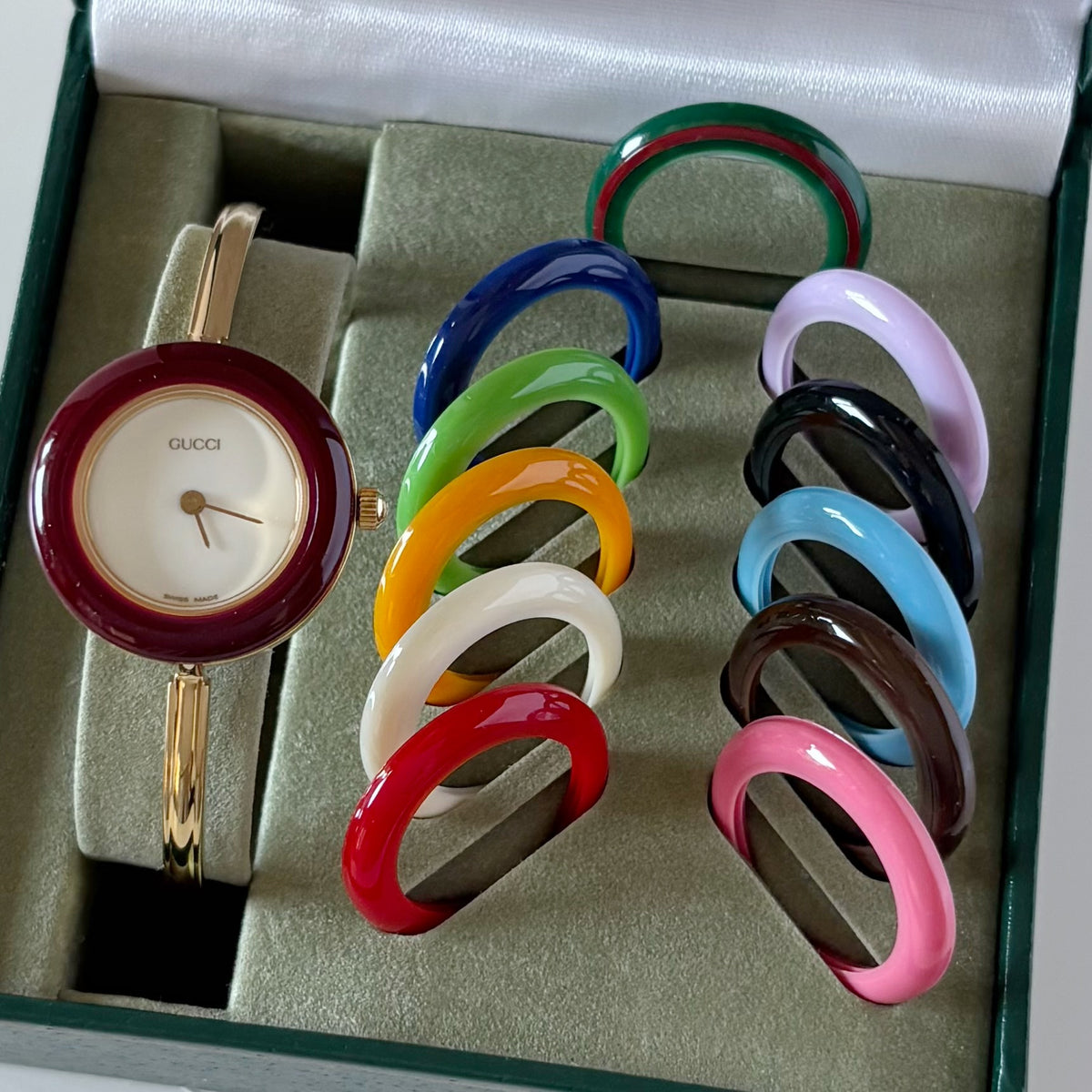 Gucci 1990s Interchangeable Bezel Gold Plated Bangle Watch with 12 bezels, case