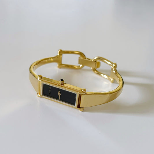 Gucci 1990s Black Dial Rectangular Gold Plated Bangle Watch