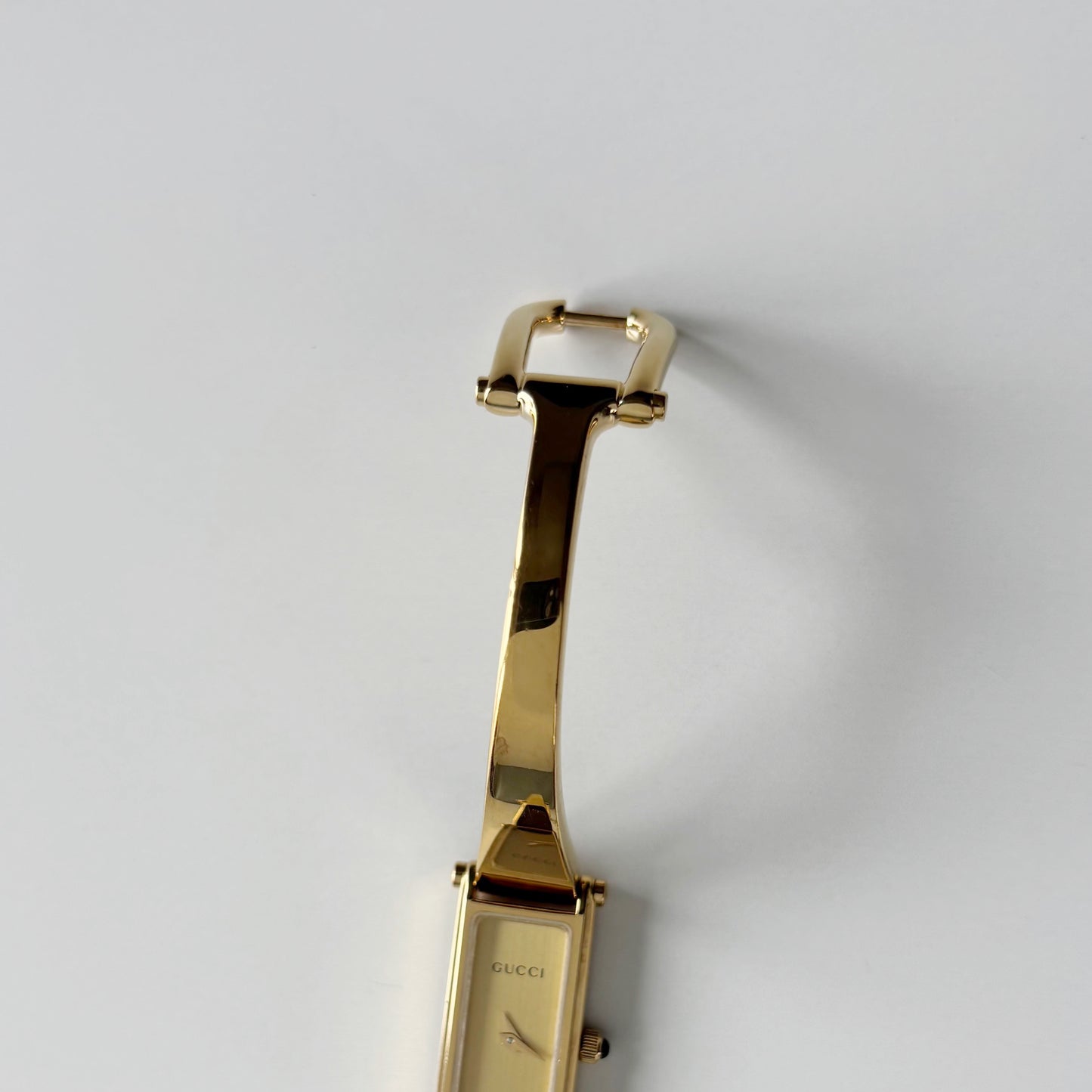 Gucci 1990s Gold Rectangular Dial Gold Plated Bangle Watch