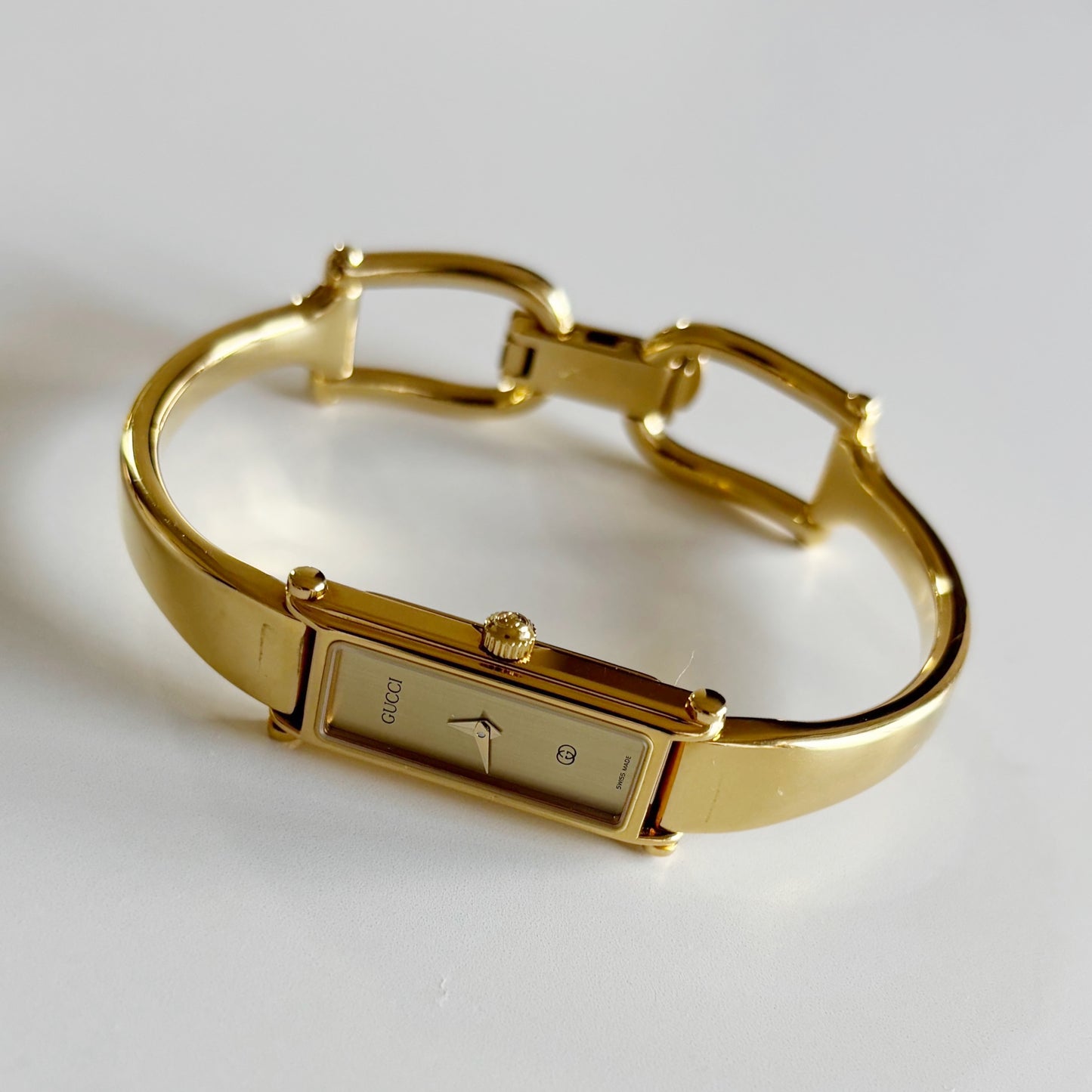 Gucci 1980s Rectangular Gold Dial Gold Plated Bangle Watch