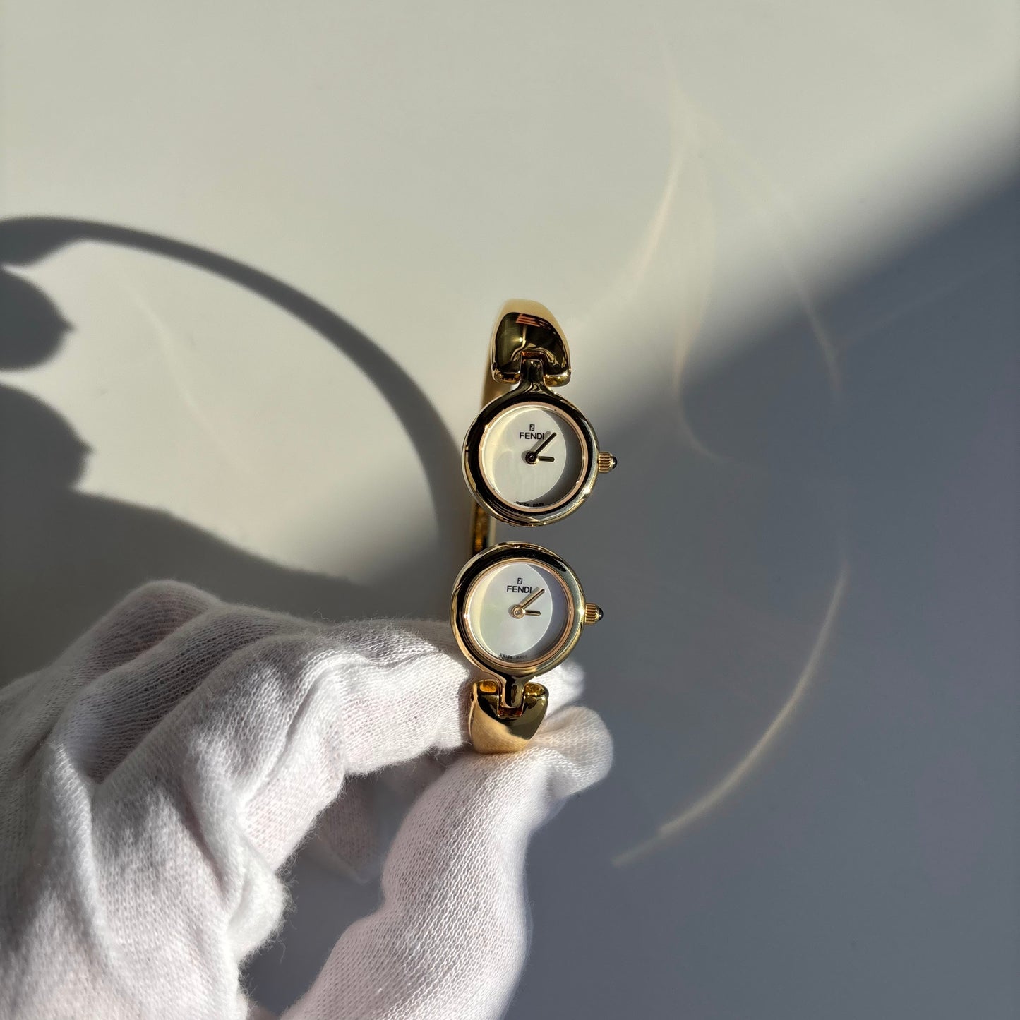 Fendi 1990s Seashell Dial Two Time Zone Gold Plated Bangle Watch