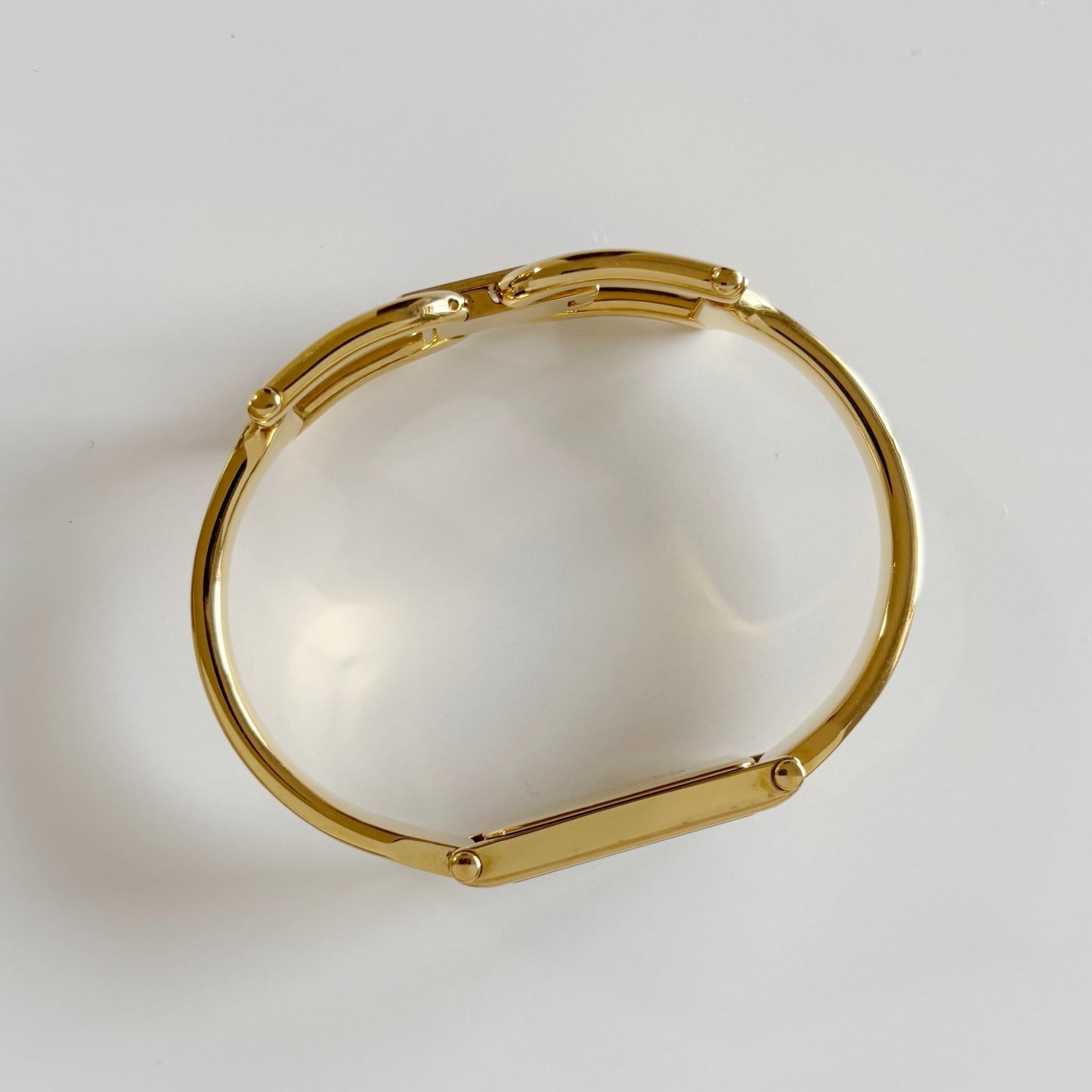 Gucci 1990s Black Dial Rectangular Gold Plated Bangle Watch