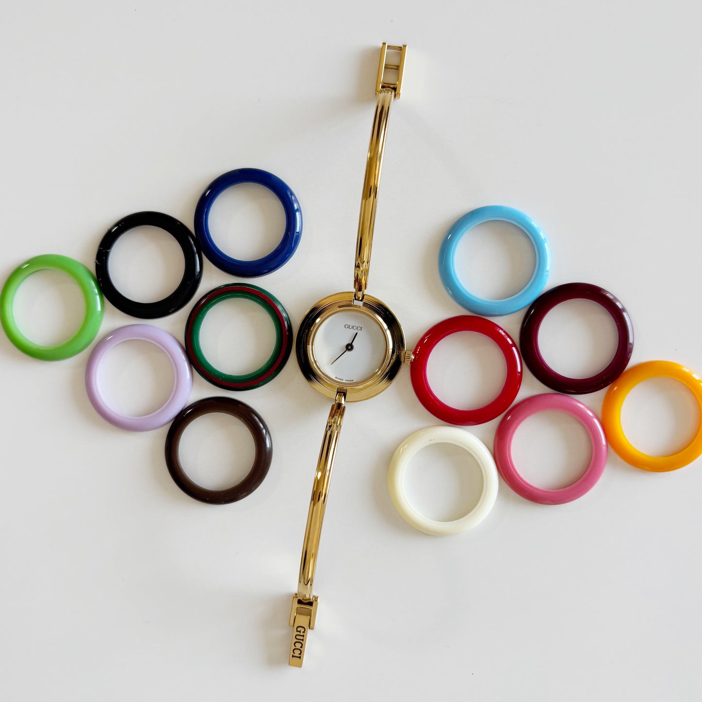 Gucci 1990s Interchangeable Bezel Gold Plated Bangle Watch with 12 bezels, case